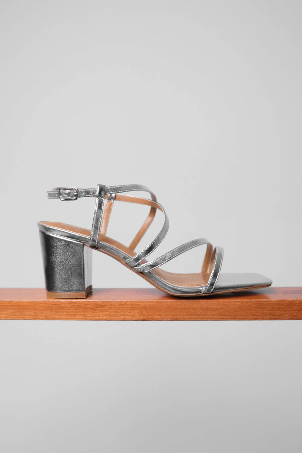 SIDRA MID HIGH BLOCK HEEL SANDALS WITH CROSS OVER STRAP IN SILVER METALLIC FAUX LEATHER